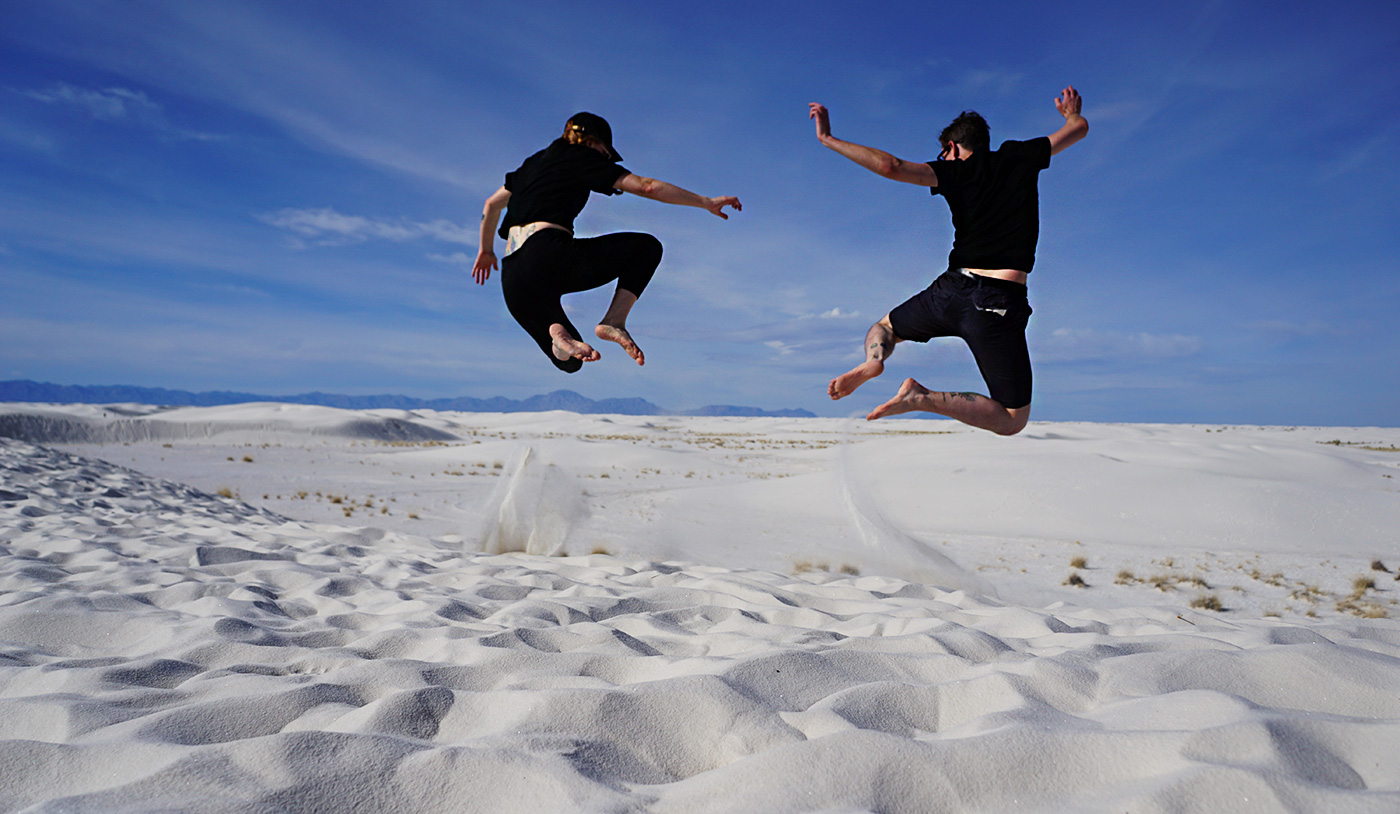 allison and eric jumping the dunes